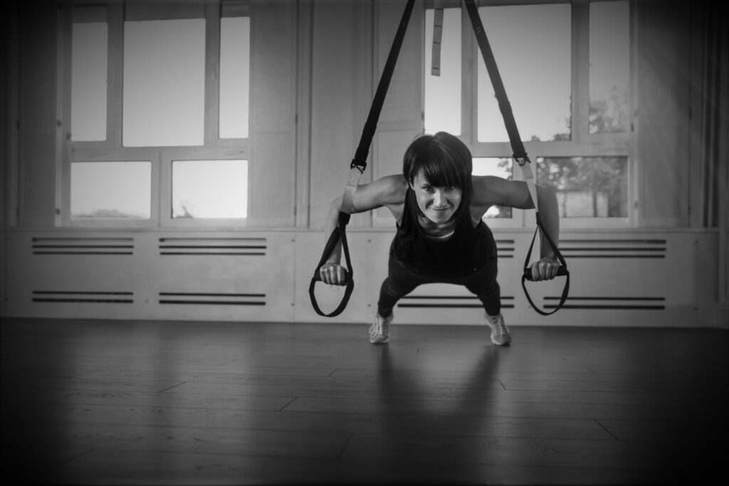 girl on trx suspension trainer